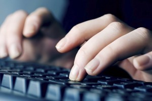 Female hands typing on comuter keyboard